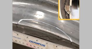 A wheel with an internal crack detected by ACWDS before the wheel was removed from the FAST train. The inset photo is an example of a broken wheel that might result from such a defect.