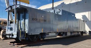 The Rail Escort Vehicle (pictured) was designed in accordance with Association of American Railroads Standard S-2043 for trains used to transport spent nuclear fuel and high-level radioactive waste.