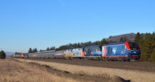 First run: Amtrak no. 8, the eastbound Empire Builder, overtakes a BNSF empty grain train at Moab, Wash. Bruce Kelly photo
