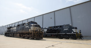 A before and after look at Norfolk Southern locomotives at Wabtec’s Locomotive plant on Aug. 6, 2021 in Fort Worth, Tex. Wabtec celebrated its 1,000th locomotive modernization in North and South America. (Brandon Wade/AP Images for Wabtec)