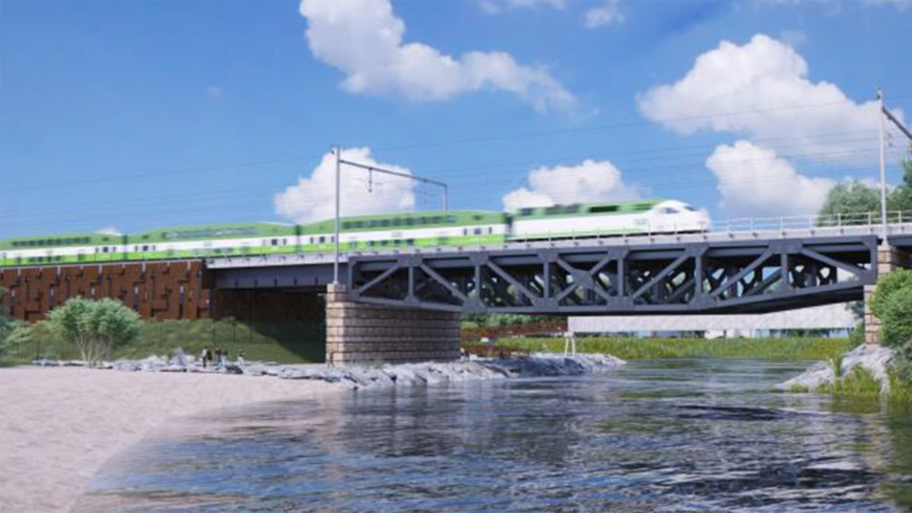 An electric powered GO train moves across a bridge, in this artist rendering. (Metrolinx image)