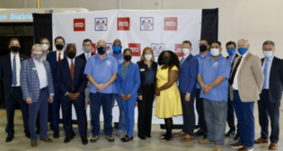 The Board of Directors at Denver RTD has authorized the agency’s General Manager and CEO Debra A. Johnson (pictured ninth from left) to enter into a successor three-year collective bargaining agreement with the Amalgamated Transit Union Local 1001, which represents two-thirds of RTD employees.
