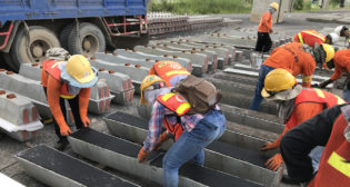 Pandrol’s under tie pads are manufactured using about 5 pounds (or 2.3 kilograms) of end-of-life tires per tie, which the company said produces “a carbon footprint that is less than half of the same product using virgin material.” It noted that “[e]very kilometer of railway track installed with Pandrol’s Under Sleeper [tie] Pads saves 3,000 tires from landfill or burning.”