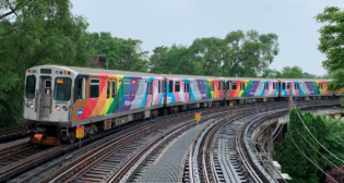 As transgender issues and rights have moved to the forefront over the last few years, CTA has added the Transgender Flag—featuring blue, pink and white—to its train wrap celebrating “Pride Month” (June). (Photograph Courtesy of CTA)