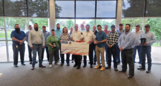 A $5,000 donation was made recently to the Sand Springs, Okla., fire department in honor of five shippers that received the 2021 OmniTRAX Safe Shipper Award from the Sand Springs Railway Company. (Photograph Courtesy of OmniTRAX)