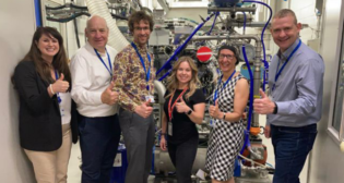 Kari Gonzales of MxV Rail (center) and members of the Ricardo team visit the H2ICE test cell at Ricardo’s Shoreham Technical Center. (Caption and Photograph Courtesy of Ricardo)