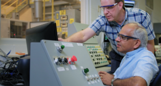 AJ Kumar (seated) joined GE Transportation—now Wabtec—in 1977, and recently earned his 362nd patent. (Photograph Courtesy of Wabtec)