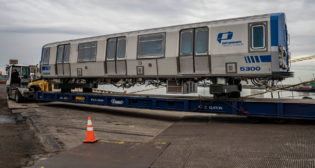 On Sept. 11, the first two of 72 Kawasaki-built rapid transit cars for the Port Authority of New York and New Jersey’s PATH system arrived at Port Newark via a Ro-ro vessel originating in Japan. (Credit: PANYNJ)