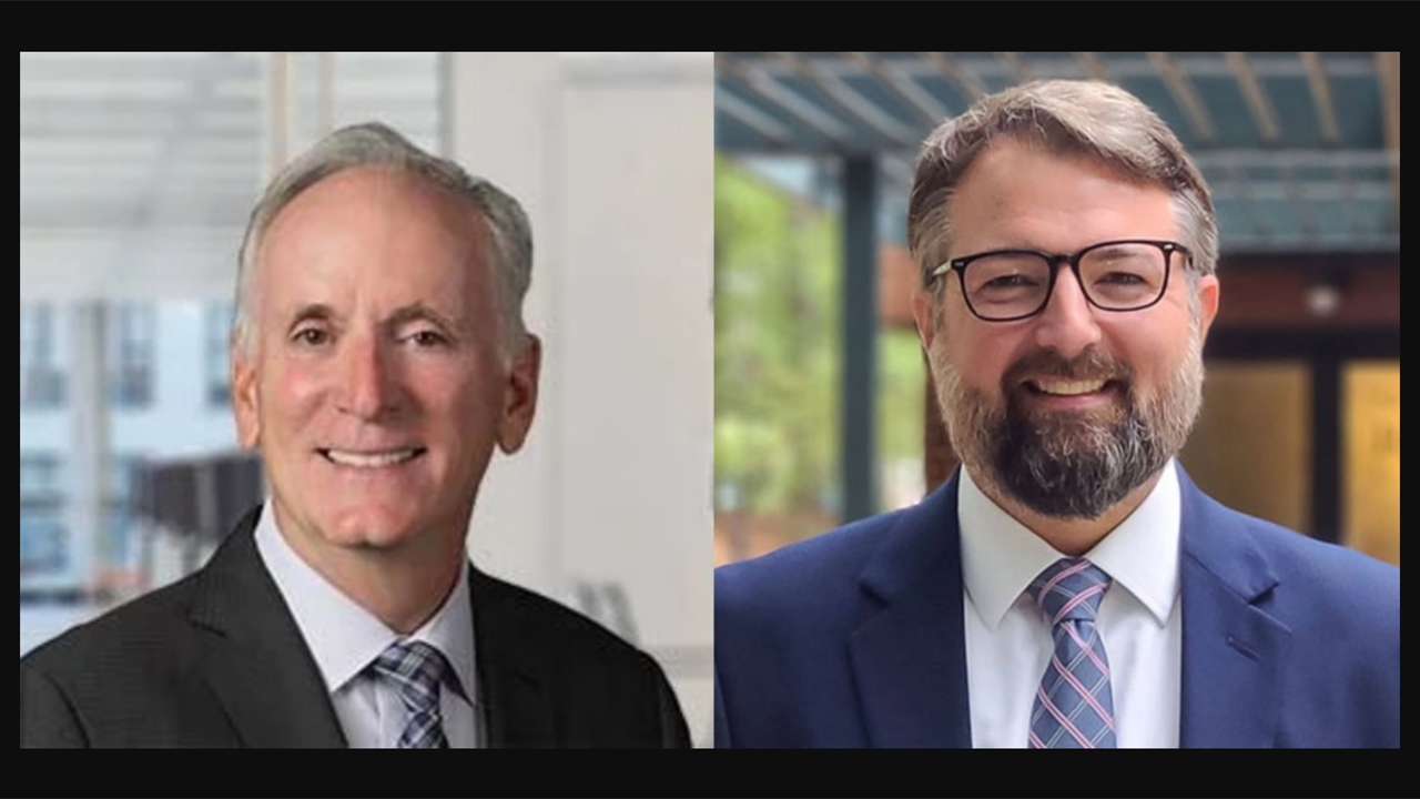 Paul Wiedefeld, Northeast Region Transportation Director, HDR (left) and Chris Dillon, Vice President, Government Affairs, North Carolina Railroad Company.