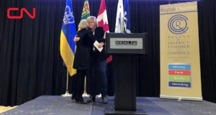 CN President and CEO Tracy Robinson (right) presents STARS President and CEO Andrea Robertson (left) with a $100,000 donation for the non-profit.