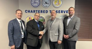 From left to right: Bi-State Development President & CEO Taulby Roach; Bi-State Development Board Chairman Herbert Simmons; IBEW Local 2 Business Manager Ken Pebbles; and IBEW Local 309 Asst. Business Manager Mark Link