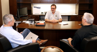 BLET Executive Committee Members Edward A. Hall (National President; center), Mark L. Wallace (First Vice President; right) and David P. Estes (National Secretary-Treasurer) are three of the 14 members of the 2023-27 BLET National Division Advisory Board. (BLET Photograph)
