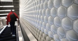 BART's bubble tiles are seen on a wall at Powell St. Station.
