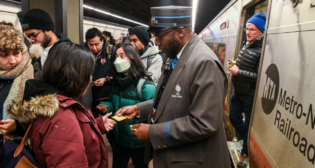 At 1:19 p.m. on Feb. 2, Grand Central Terminal’s 110th anniversary train—a local Metro-North Railroad train from Stamford, Conn., to Grand Central—arrived on Track 27. MTA officials greeted passengers and distributed commemorative stickers. (Marc A. Hermann / MTA)