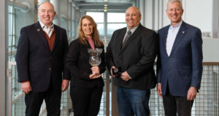 The 2022 J.C. Kenefick Safety Award winner Melissa White with, from left, Eric Gehringer, UP Executive Vice President-Operations; fellow UP employee Kent Jones; and UP Chairman, President and CEO Lance Fritz. (Caption and Photograph Courtesy of UP)