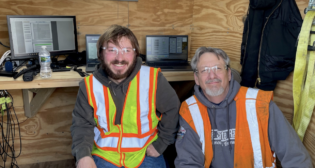 Michigan Technological University's Zach Stanchina (left) and Lake State Railway's Roger Fuehring work to collect data on locomotive emissions for a study conducted through a partnership with ASLRRA, Michigan Tech, Lake State Railway and Chicago South Shore & South Bend Railroad. The study is funded by a Federal Railroad Administration grant.
