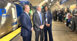 Port Authority of New York and New Jersey Chairman Kevin O’Toole (left), Executive Director Rick Cotton (center) and PATH Director Clarelle DeGraffe (right) unveiled a trainset with some of the new Kawasaki railcars at the PATH Hoboken (N.J.) station on April 13. (Credit: PANYNJ)