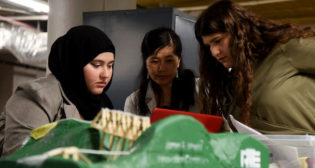 Penn State Altoona students Hagar Abdelaal (left) and Alyonna Vitulli (right) work with Shihui Shen, Professor of Rail Transportation Engineering, during the fourth annual Women in Engineering Design competition. (Credit: Jacob Narup of Penn State)