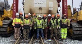 Team members of R. J. Corman Railroad Services Emergency. From left to right, Rob Ralcewicz, Austin Singer, Greg Feasel, Rodney Clayton, Austin Clayton, Mike Hahn, David Fields, Mike Buchanan, Colin Hill, and Tim Koon.