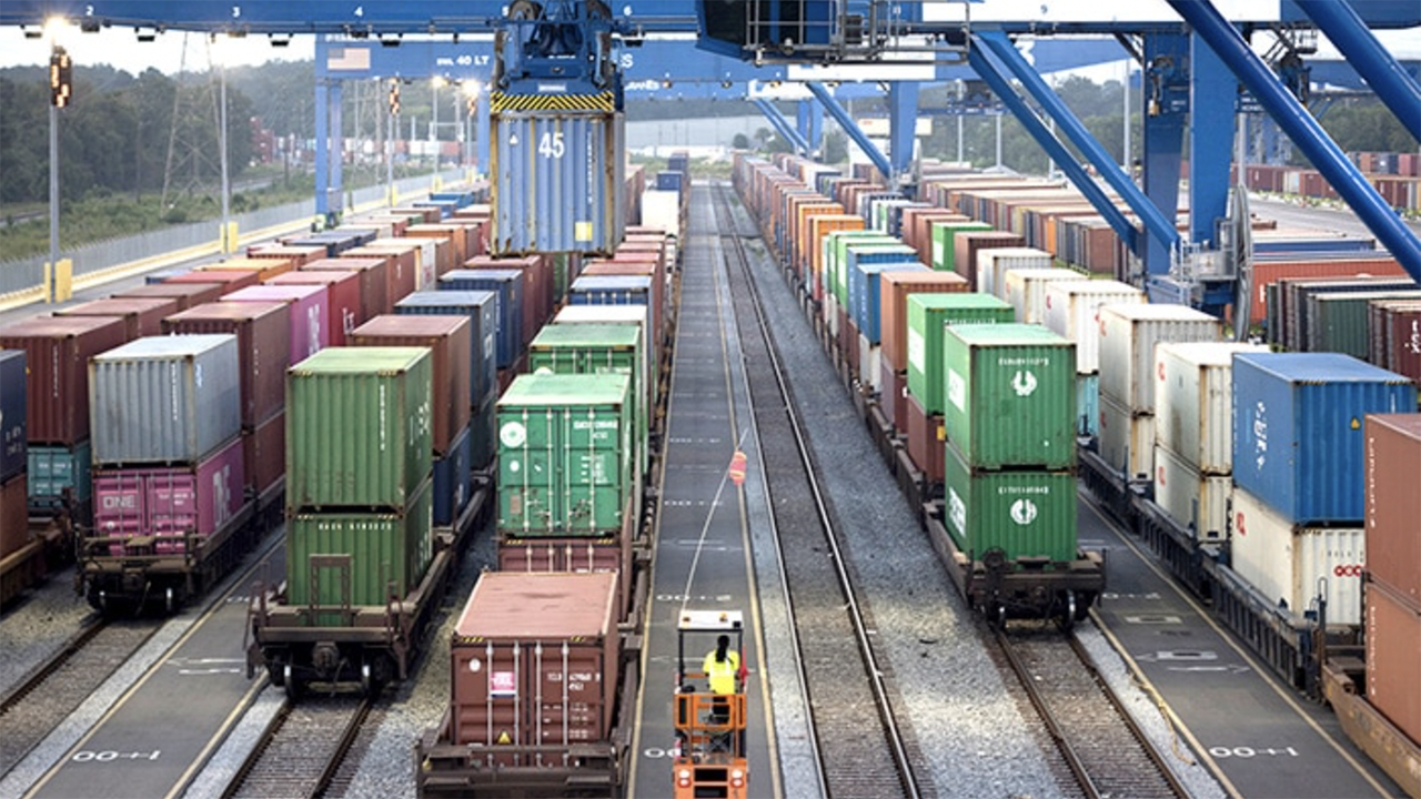 Rail-mounted gantry cranes work trains at the Port of Savannah’s Mason Mega Rail Terminal. Containers moving by rail from Savannah to the planned Northeast Georgia Inland Port in Gainesville, Ga., will avoid a round-trip truck route of 602 miles on Georgia highways. [Photo:Georgia Ports Authority / Stephen Morton]