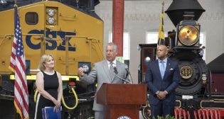 CSX has donated $5 million to help transform the B&O Railroad Museum in celebration of B&O’s bicentennial anniversary in 2027. Pictured: B&O Railroad Museum Executive Director Kris Hoellen (left), CSX President and CEO Joe Hinrichs (center) and Maryland Gov. Wes Moore. (CSX Photograph)