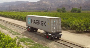 Pictured: Parallel’s prototype railcar loaded with a shipping container. (Photo courtesy of Parallel Systems)