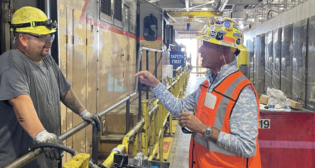 UP Chairman Lance Fritz, right, speaks with UP Machinist Marco Melendez during a recent field visit to the Proviso Diesel Facility in Illinois. (Caption and Photograph Courtesy of UP)