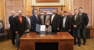 Gov. Laura Kelly on Oct. 11 announced that Kansas would have a two-person crew rule “to improve safety.” (Gov. Kelly’s Office Photograph)