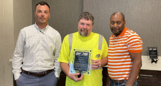 Norfolk Southern’s Operations Division Safety and Service Committee recently recognized six Midwest Division railroaders, including Tim Hunt (center), for their commitment to safety. Pictured with Hunt are Wayne Strickland (left) and Cortez Mason, Mechanical. (NS Photograph)