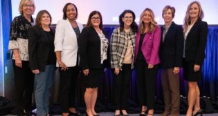 Past LEAD presidents attending the conference included, from left, Lori Loschen, general director, Marketing and Sales; Carrie Powers, assistant vice president-Financial Reporting, and current LEAD president; Polly Harris, vice president-Human Resources; Jill Bazzell Stenstrom, general director-Real Estate; Beth Whited, president; Beth Steele, general director, Marketing and Sales; Jennifer Hamann, executive vice president-Finance and chief financial officer; and Jennifer Sedlacek, senior director-Engineering Capital Budget.
