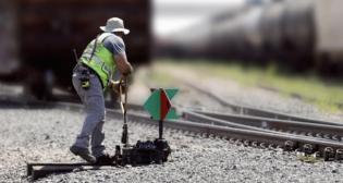 Part of a systemwide standardization initiative, new green-red switch targets indicate to operators when trains will be guided—or switched—from one track to another. (Caption and Photograph Courtesy of UP)