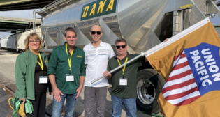 Union Pacific’s Todd Hackel (white shirt) attended the grand opening of the Kansas City facility with Dana Transport representatives Kim Feager, Dennis Lawless and Shawn Hensley. (Caption and Photograph Courtesy of UP)