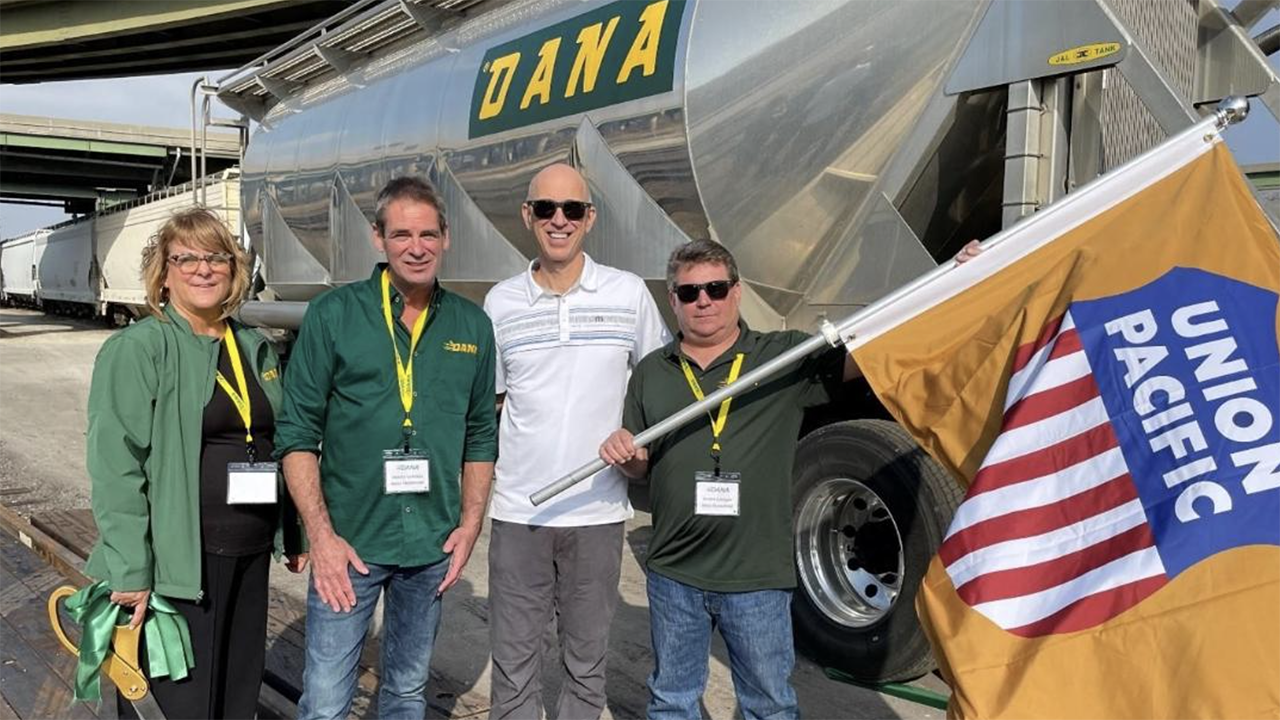 Union Pacific’s Todd Hackel (white shirt) attended the grand opening of the Kansas City facility with Dana Transport representatives Kim Feager, Dennis Lawless and Shawn Hensley. (Caption and Photograph Courtesy of UP)