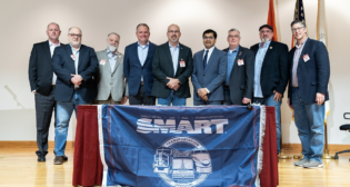 NS, SMART-TD and BLET on Feb. 15 signed an agreement to participate in FRA’s Confidential Close Call Reporting System (C3RS). Pictured: SMART-TD officers flank TD President Jeremy R. Ferguson (center), NS President and CEO Alan Shaw (left of Ferguson) and FRA Administrator Amit Bose (right of Ferguson) at the signing ceremony in Atlanta. (Photograph Courtesy of SMART-TD, NS)