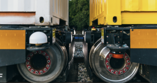 According to Parallel Systems, its autonomous battery-electric freight cars “form platoons through bumper-to-bumper contact.” Traditional coupling is not required, allowing “freight to [be] sort[ed] on the rail network,” it reports. (Parallel Systems Photograph)