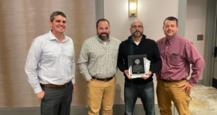 Norfolk Southern's Modesto Tamayo (second from right) was recognized for his contribution to the railroad at a ceremony in South Bend, Ind., on Nov. 2.