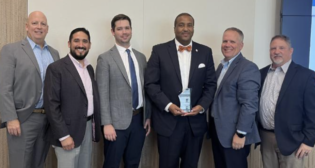 LyondellBasell has awarded UP for “safe, reliable service.” Representing the railroad at an awards presentation were Marty Russell, General Director-Sales, left, and Senior Managers-Train Operations Ryan Broeckelmann and Chad Toussaint, third and fourth from left. (UP Photograph)
