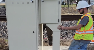A hydrogen supplier installs a new hydrogen-powered fuel cell at a Union Pacific crossing in Louisiana. (Caption and Photograph Courtesy of UP)