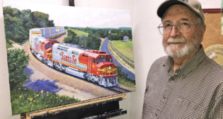 Lithograph and canvas giclee prints of railroad artist John Winfield’s 1993 “Warbonnet Renaissance” painting of red and silver Santa Fe 93 pulling a freight train through the Flint Hills of Kansas near Matfield Green (above) are available for sale by Great Plains Transportation Museum to aid in its effort to cosmetically restore Santa Fe 93. (Photograph Courtesy of Great Plains Transportation Museum)