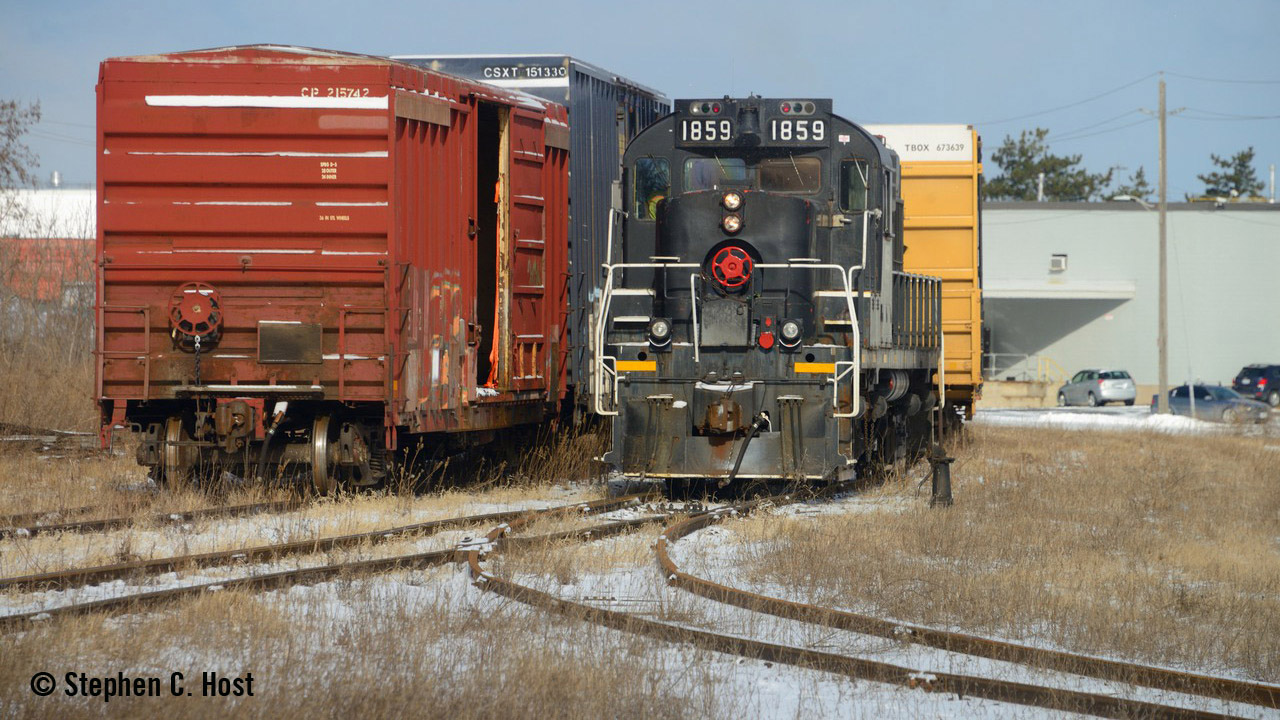 GIO Railway's final train to St. Catharines, Ontario, shuffling boxcar loads of pulp from the USA as the crew prepares to spot the customer for the final time on Feb. 29. (Stephen C. Host)