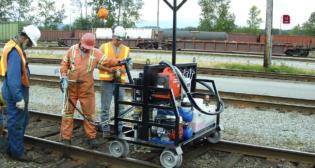 Pictured: Use of SpikeFast® shortly after its 1999 market introduction. (WVCO Railroad Solutions Photograph)