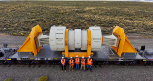 Atlas (pictured) is a 12-axle U.S. Department of Energy-designed railcar for transporting shipments of spent nuclear fuel weighing up to 480,000 pounds (240 tons). The $33 million project took 10 years to complete. (DOE Photograph)