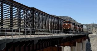 “The concentrated wind gusts at this location coming out of Abo Canyon [in New Mexico] have caused problems in the past,” reports Craig Rasmussen, BNSF Assistant Vice President of Engineering, Services and Structure. “Installing the wind screen will help by lowering the wind impact against the side of trains, which will help keep trains safely flowing through the area.” (BNSF Photograph)