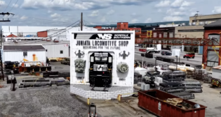 The team at Juniata Locomotive Paint Shop in Altoona, Pa., “creates the face of the Norfolk Southern”—from its Heritage units to the new Thoroughbred Locomotive and everything in between. (Screenshot of NS Video showcasing Juniata).