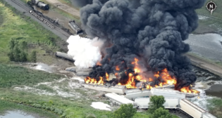 Aerial view of derailment site. (Foster County Emergency Management Photograph, Courtesy of NTSB)