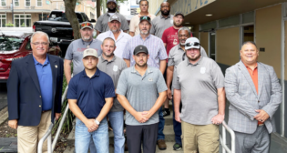 BLET Vice President Randy Fannon (far left) and BLET Special Representative Jorge Gomez (far right) with newly organized members from Florida Gulf & Atlantic in 2023. (Caption and Photograph Courtesy of BLET)