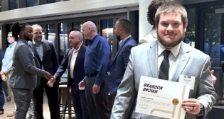 “From mastering railroad operations to earning their Conductor certifications at the NS Training Center, they’ve built the skills, knowledge, and confidence to excel in their careers,” NS said of the graduates of its Rail Transportation Management Trainee program. The railroad recently recognized nearly 50 graduates in its Atlanta, Ga., headquarters. (NS Photograph)