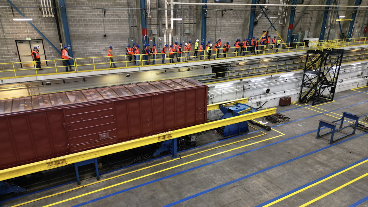 Overview of the refreshed Simuloader (SMU) being showcased to a breakout tour group during the 2024 TTC Conference & Tour. (TTC Operated by ENSCO Photograph)