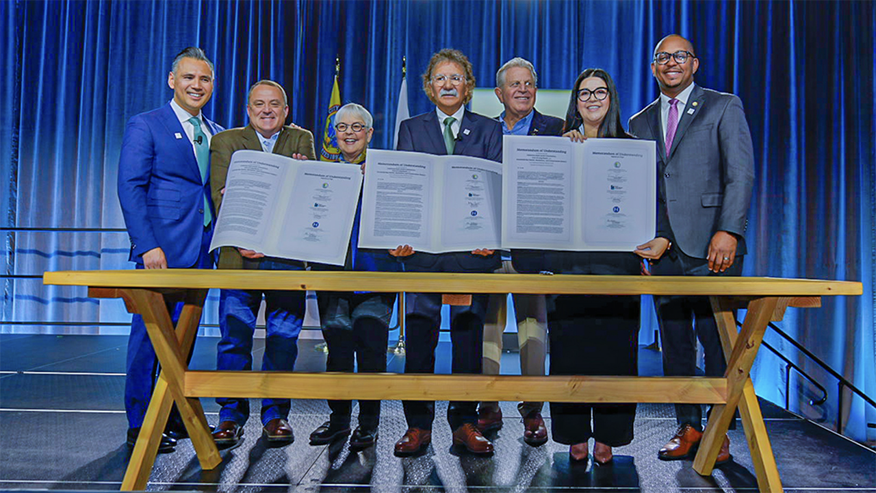 At the conclusion of POLB’s State of the Port address earlier this month, officials signed a memorandum of understanding to collaborate on offshore wind power projects. Pictured, from left to right: Port of Long Beach COO Dr. Noel Hacegaba, Port of Humboldt Bay Executive Director Chris Mikkelsen, Long Beach Harbor Commission President Bonnie Lowenthal, Port of Long Beach CEO Mario Cordero, Long Beach Harbor Commission Vice President Frank Colonna, State Lands Commission Senior Mineral Resources Engineer Vanessa Perez, and Long Beach Mayor Rex Richardson. (POLB Photograph)