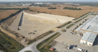 This drone image shows the site of Iowa Interstate Railroad's wind energy component transload facility in Newton, Iowa, while it was under construction. Directly adjacent to the facility is TPI Composites, a wind turbine blade manufacturer. (Caption and Photograph Courtesy of ASLRRA)